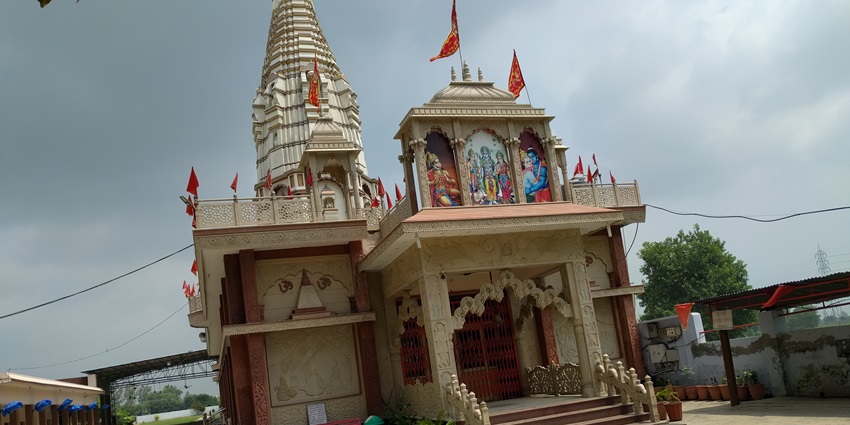 An inclined view of Lord Hanuman’s temple with his and Lord Rama’s paintings on it