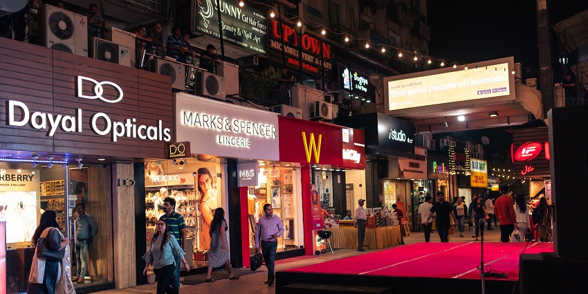 Image of a vibrant shopping complex bustling with locals at night