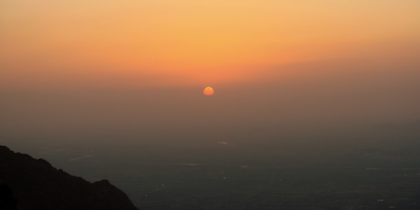 Capturing vibrant colours of the sky as the sun dips below the horizon, a popular thing to do in Mount Abu