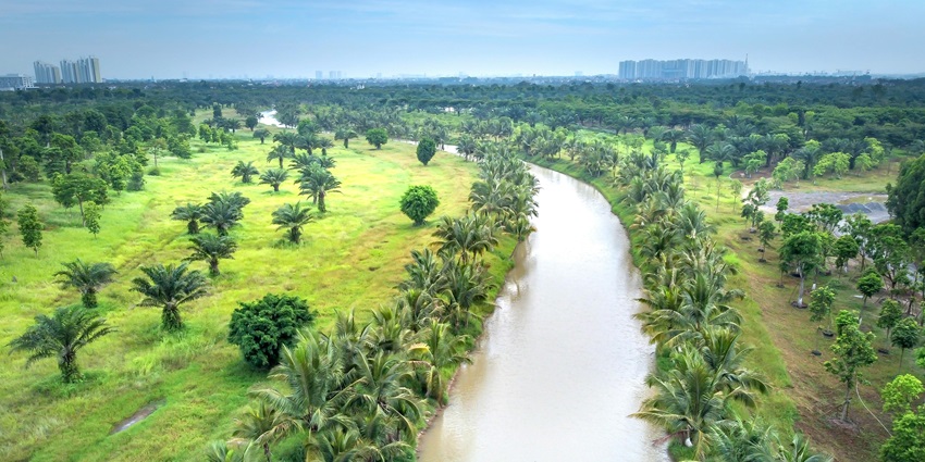 Aerial view of a sparkling water channel, highlighting its graceful curves and flow.