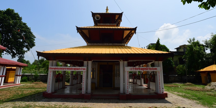 A frontal view of a traditional Hindu temple in Morni Hills, surrounded by greenery