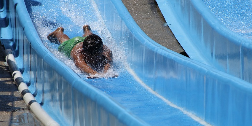 A thrilling blue water slide at Mauj Mahal Water Park and Fun Resort, Jaipur, perfect for family fun.