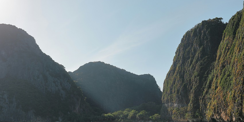 An image of Maya Bay waters for Phi Phi Island snorkelling with two boats in the waters.