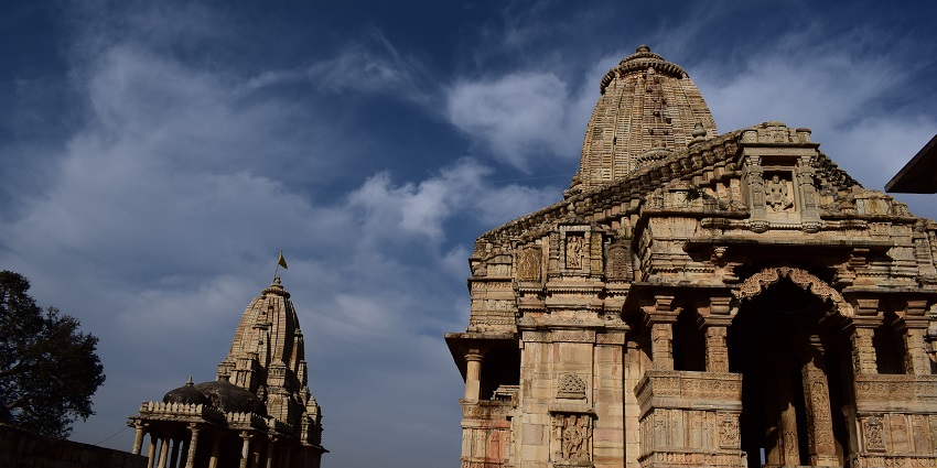 Exterior view of Meera Temple in Rajasthan with traditional Indian architectural elements.