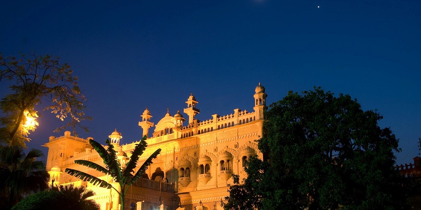 A picture of a hotel in Meerut taken at night in a well-illuminated state