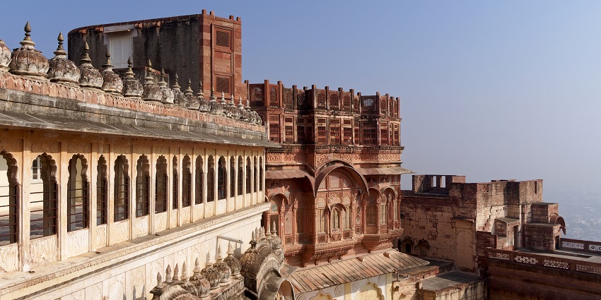 Mehrangarh Fort, a major tourist attraction near Dhawa Doli Wildlife Sanctuary with massive walls, intricate carvings, and panoramic city views.
