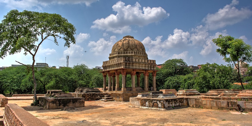 Mehrauli Archaeological Park is surrounded by lush greenery and historical landmarks.