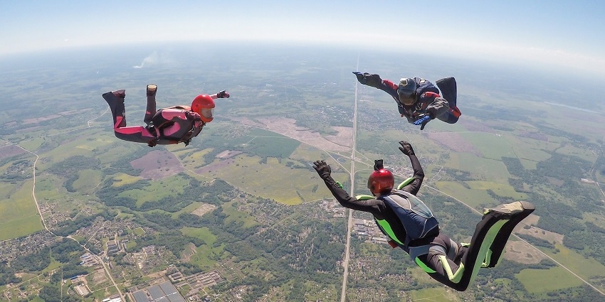 An image of a a group of tandem jumper gliding down at Mehsana, Ahmedabad