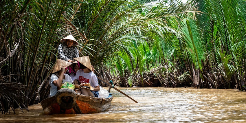 Calm Mekong Delta canal with boating setting, a unique tourist attraction in Vietnam