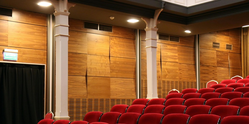 Image of Red Theater Chair Lot Near White Concrete Pillars - nightlife in Vadodara