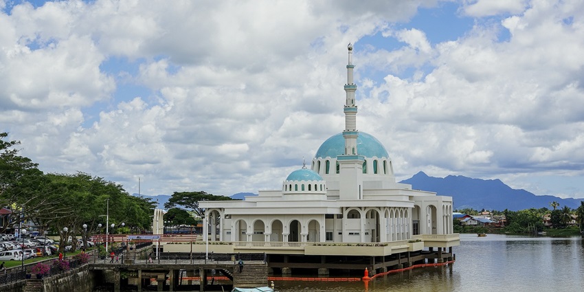 Scenic view of a mosque within a serene landscape, illustrating the significance of Nepal.