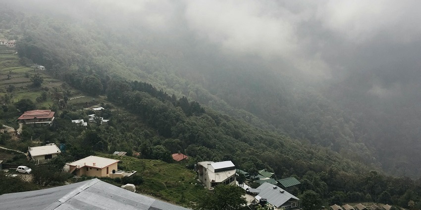 Image of misty weather envelops Pangot, creating a serene and tranquil landscape.