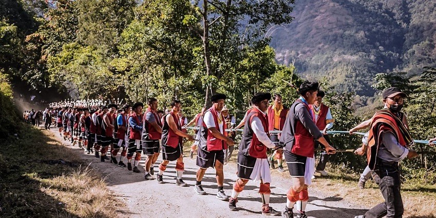 Angami tribe members in traditional attire, standing together in a cultural display of Nagaland's rich heritage.