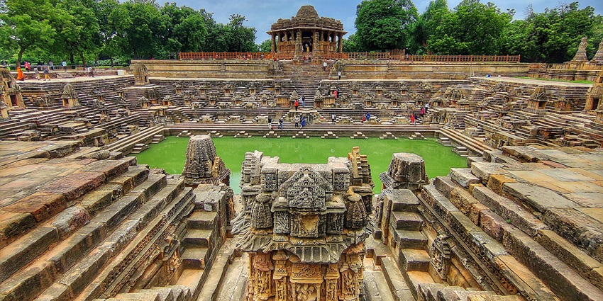 Modhera Sun Temple with intricate carvings and architecture, highlighting its historical grandeur.