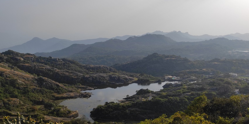 View from Shooting Point in Mount Abu, showcasing lush hills and expansive landscapes