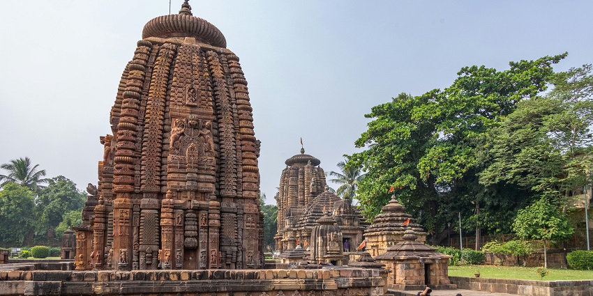 Mukteswara Temple, elegantly surrounded by tranquil water and lush trees