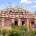 Picture of entrance to the White Tiger Safari and Mukundpur Zoo with visitors rushing inside