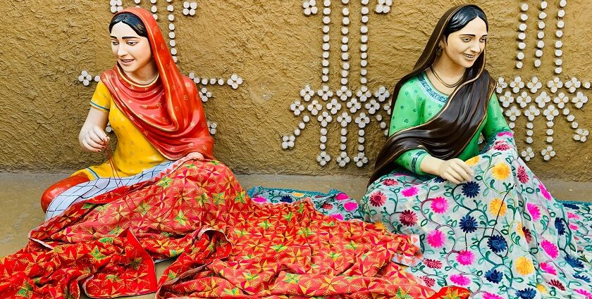 An image of two women sitting on a bed at one of the museums in Patiala, Punjab, India.