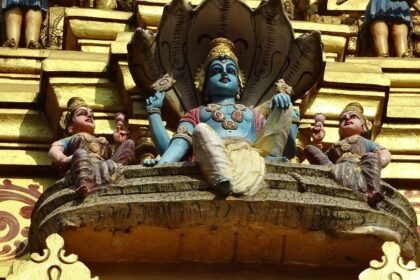 View of Muthumariamman Temple with its ornate architecture and lush surroundings