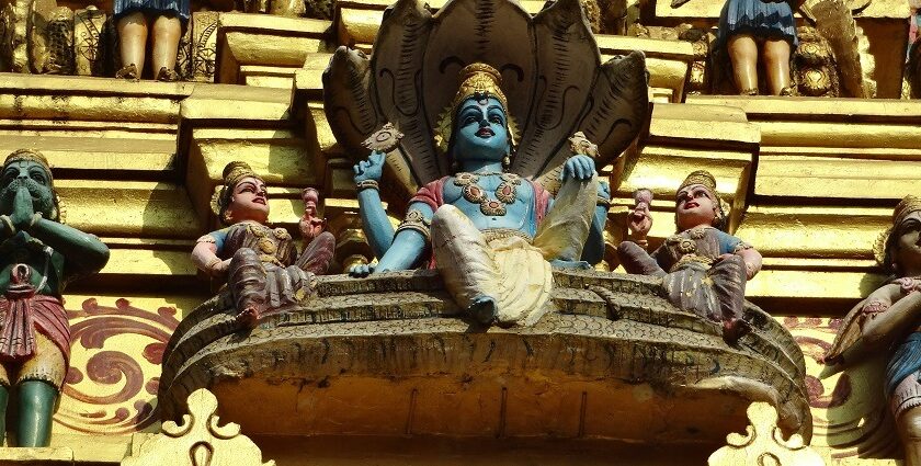 View of Muthumariamman Temple with its ornate architecture and lush surroundings