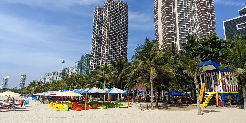 My Khe Beach in Da Nang, lined with palm trees, popular in places to visit in Da Nang.
