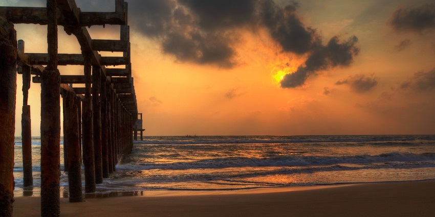 Serene sunrise over Mypadu Beach in Andhra Pradesh, with calm waves and a peaceful coastal landscape.