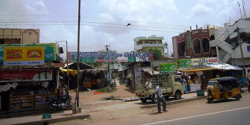 Views of busy roads and commercial buildings surround the circle, which is a great place for shopping in Vijayawada.