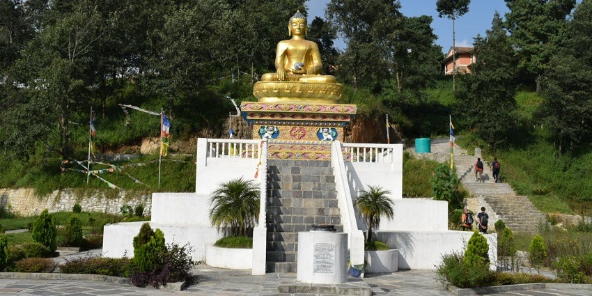 A picture of a Buddha temple with a statue of Buddha on top, one of the best places to visit in Nepal for couples