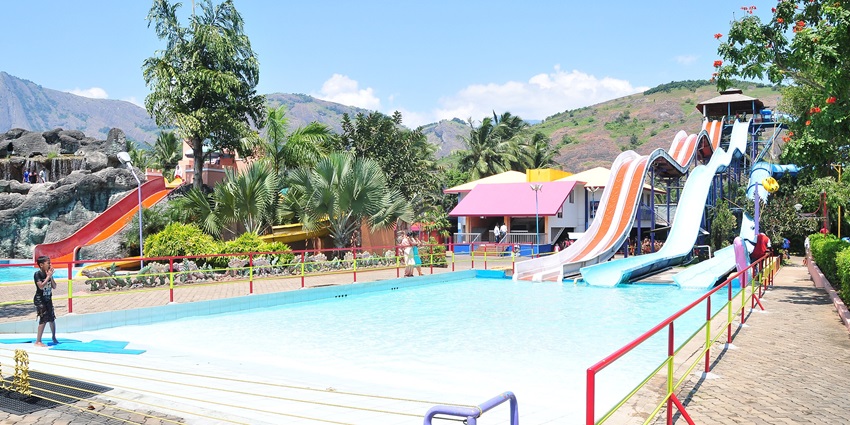 Snapshot of the scenic pool in the amusement park amidst the tropical landscape