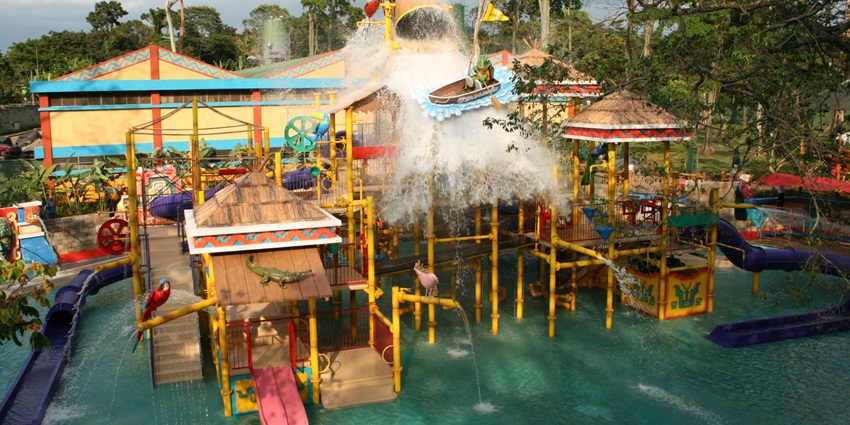 Snapshot of the water world which is surrounded by the giant lush green tress and water