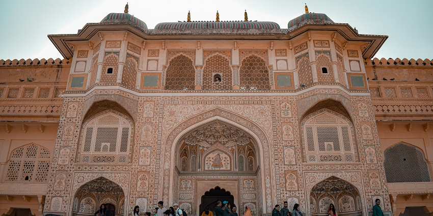 A view of the majestic Nahargarh Fort from below with a group of people in front.