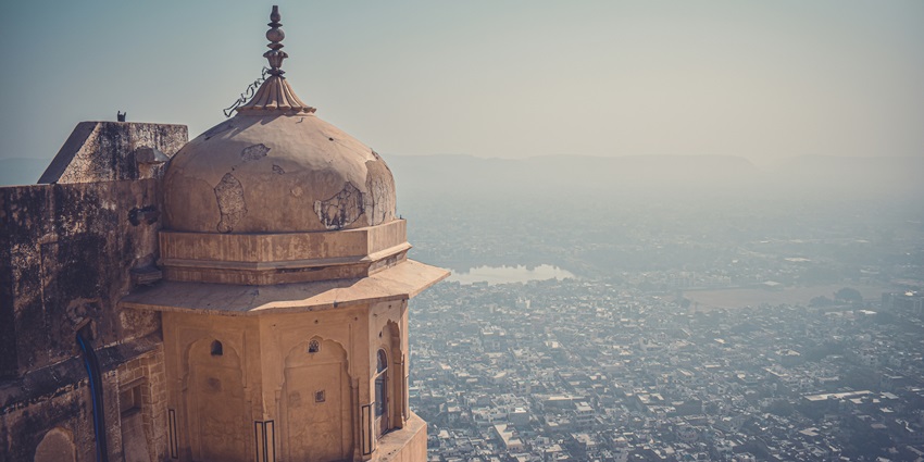 Majestic Nahargarh Fort perched atop the Aravalli Hills, overlooking Jaipur's skyline.