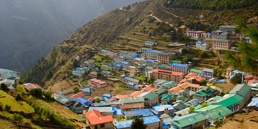 Namche Bazaar, a busy market town in the Khumbu region of Nepal, nestled in Himalayan peaks.