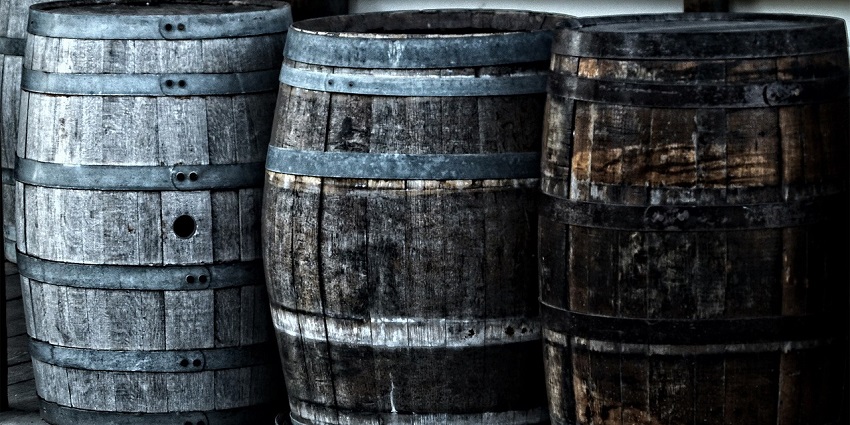 Wooden barrels in a Bhutanese brewery which is one of the places for shopping in Bhutan.