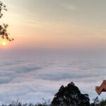 Panoramic view of the sunrise at hill stations near Bangalore within 100 Kms surrounded by foggy clouds