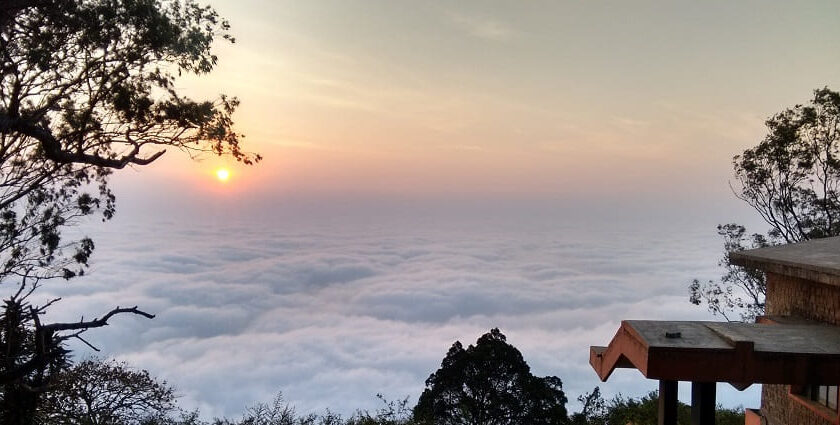 Panoramic view of the sunrise at hill stations near Bangalore within 100 Kms surrounded by foggy clouds