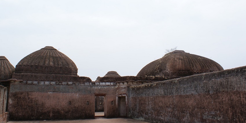 View of the historic Narsinghgarh Fort, perched on a hilltop, with its grand architecture.