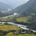 A breathtaking view of Bhutan's lush mountains and valleys, highlighting the country's natural beauty