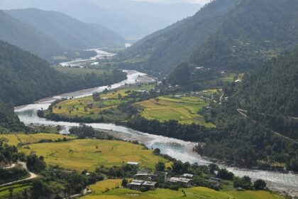 A breathtaking view of Bhutan's lush mountains and valleys, highlighting the country's natural beauty