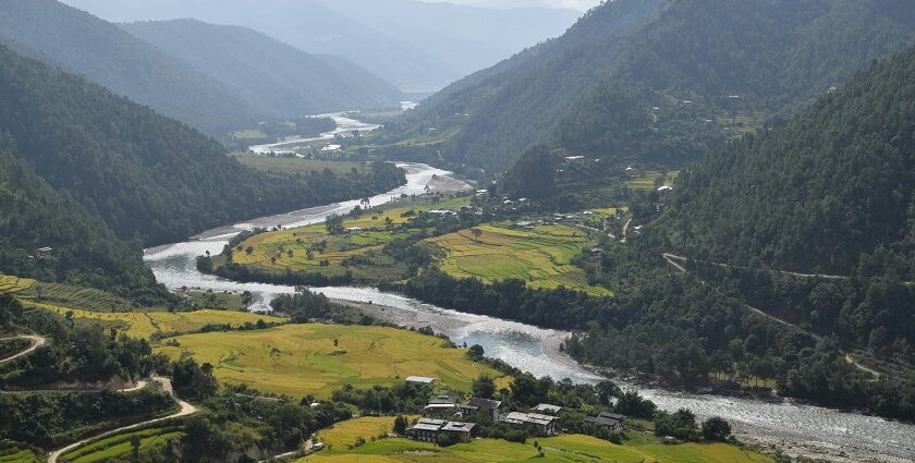 A breathtaking view of Bhutan's lush mountains and valleys, highlighting the country's natural beauty