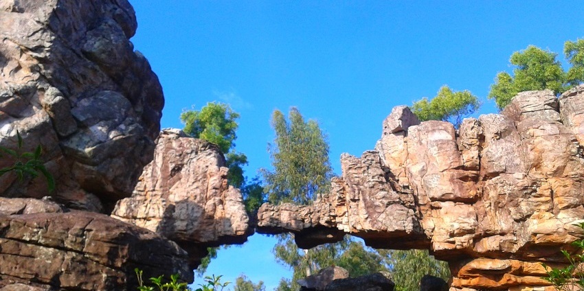 Unique natural rock formations at Sila Thoranam, showcasing stunning geological features.