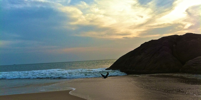 Sunrise over the placid Navunda Beach and deserted shoreline make it a picturesque location