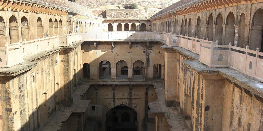 Neemrana Stepwell features intricate designs, a tourist hotspot near Mahendragarh Fort.