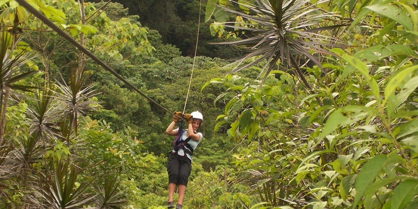 A tourist enjoying zip lining, an exciting outdoor experience in Neemrana
