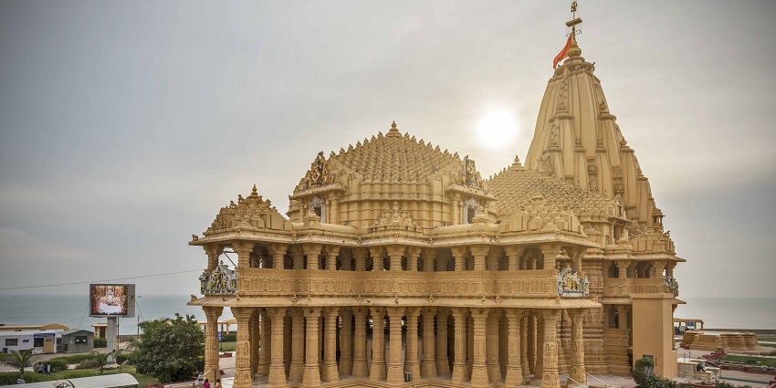 Picturesque view of the temple with golden halo of the sun rays in the background