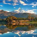 A stunning view of lake and Himalayan peaks in Nepal–perfect spot for Nepal Music Festival