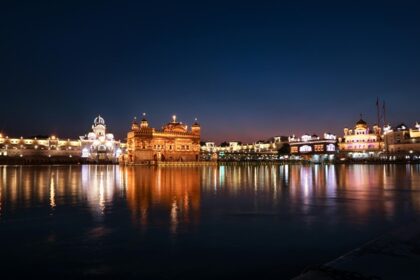 An image of festive New Year decorations with colourful lights and confetti over the city