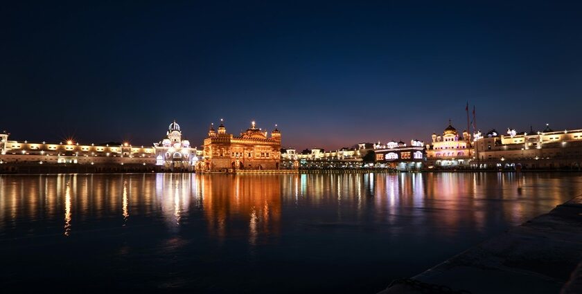 An image of festive New Year decorations with colourful lights and confetti over the city