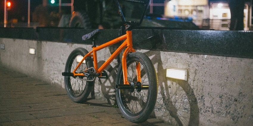 Image of Orange and Black BMX Bicycle at night view - go for a night cycling event