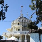 The exterior of Dilwara Temple, one of the temples in Mount Abu, with marble carvings.